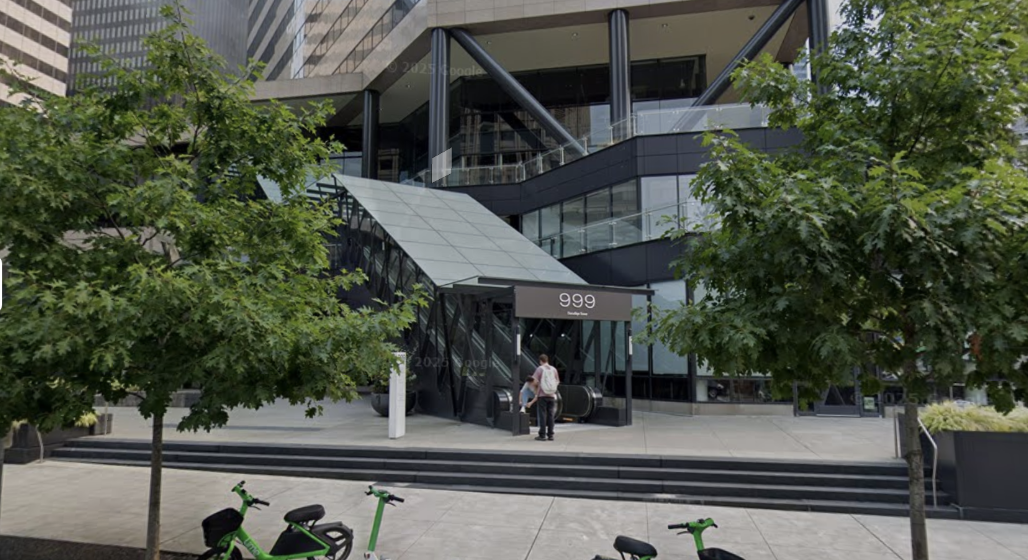 999 3rd Ave street-level entrance on 2nd Avenue with the covered escalator
